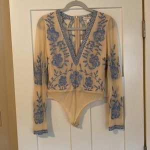 Brand new never work lace deep V bodysuit